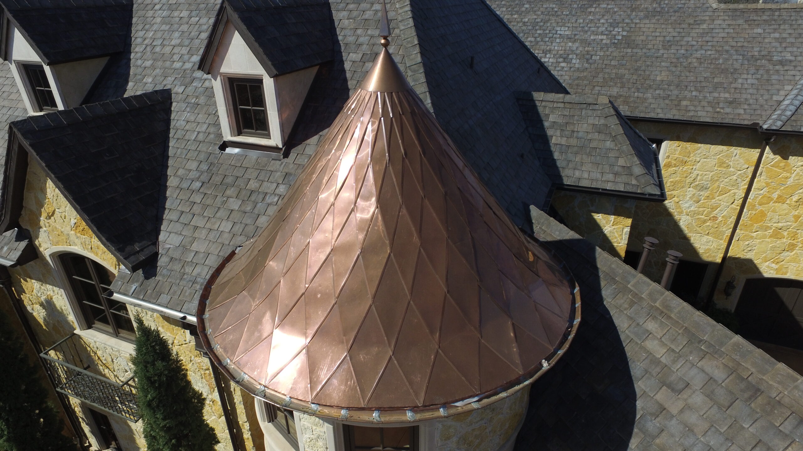 Velco Roofing slate roof with custom copper turret detail